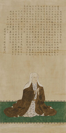 上部に古文が書かれており、下には手を合わせて座っている女性の描かれた古い絵の画像